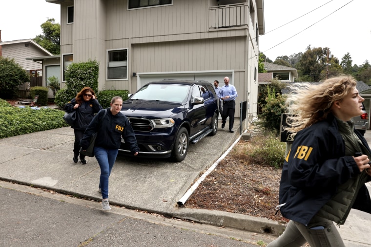 FBI agents leave a home associated with Oakland Mayor Sheng Thao during a raid in Oakland, California on June 20, 2024.