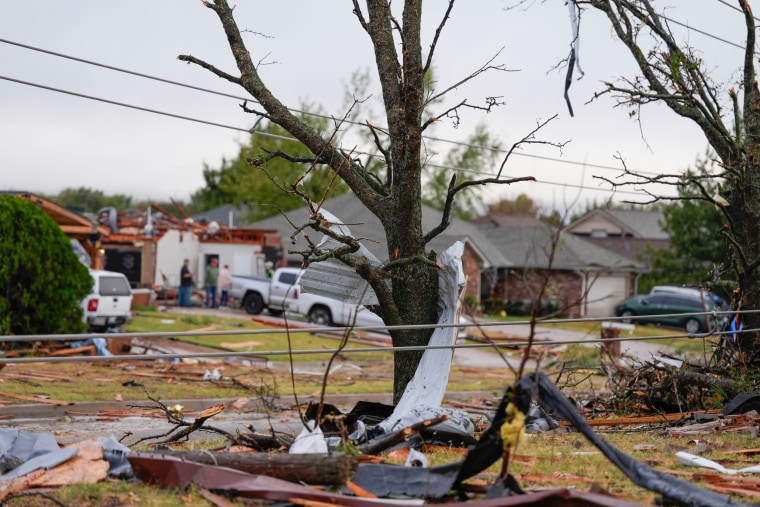 Storm debris along SE 84 after a tornado struck the Oklahoma City area on Sunday.