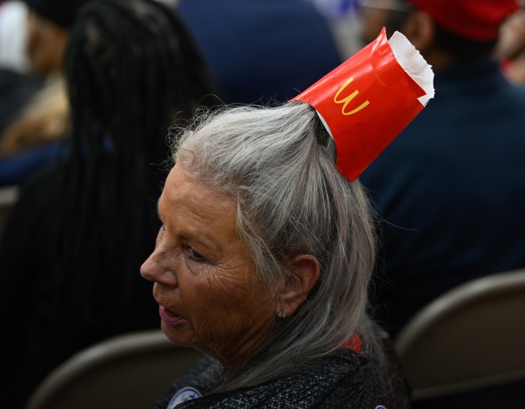 A Trump supporter wears an empty McDonald's fries container in her hair 