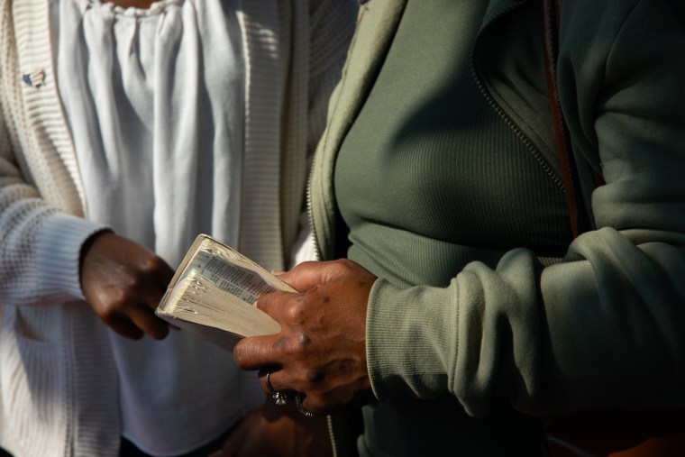 A person holds a bible