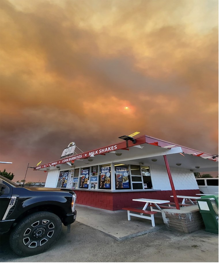 Fire and smoke flare behind B&J Drive-In in Ventura, California on November 6, 2024.