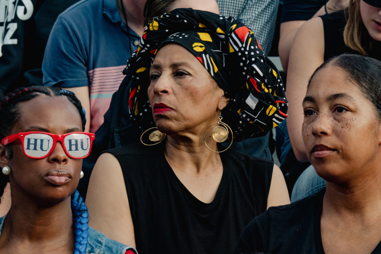 People listen to Harris give her concession speech Wednesday at Howard University.