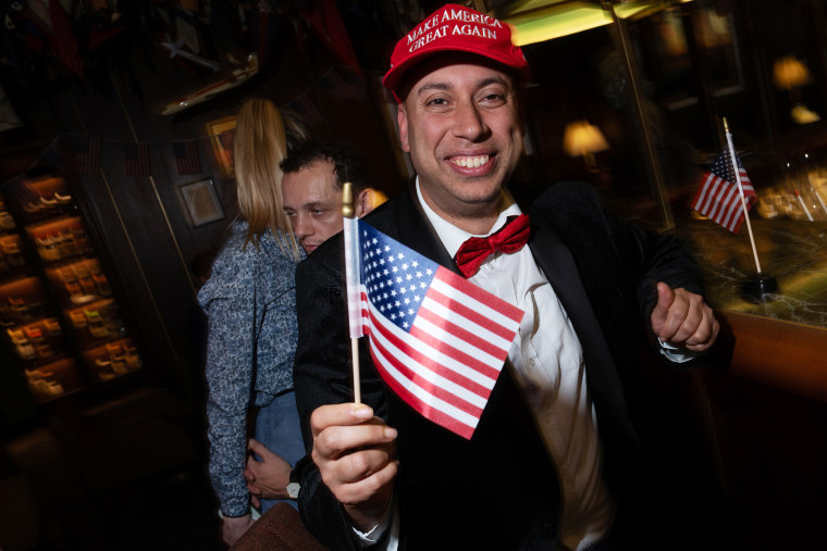 Top Stories Tamfitronics A Trump supporter during an election night watch party in London this morning.