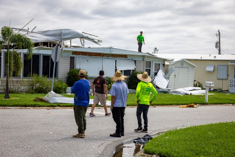 Roofing workers.