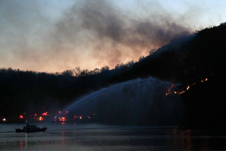 A New York City Fire Department boat works to put out a brush fire in the Inwood Hill Park section of northern Manhattan on Nov. 13. 