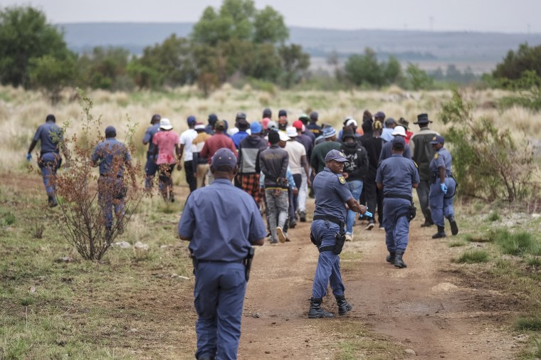 South African police in standoff with hundreds of illegal miners in disused shaft