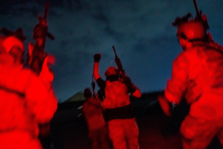 Taliban fighters with guns.