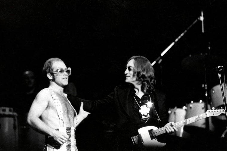 John Lennon onstage with Elton John