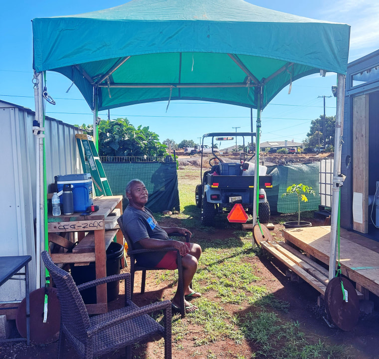 Earle Kukahiko Jr. sits outside his sister's house where he is now living.