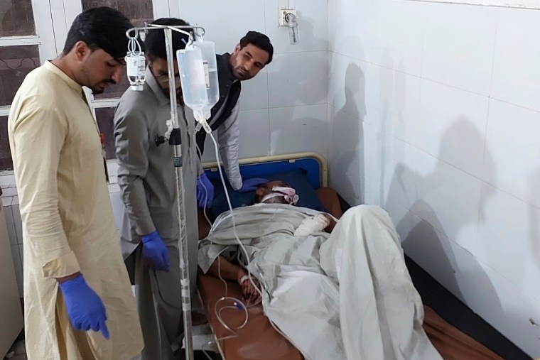 An injured person with hospital workers 