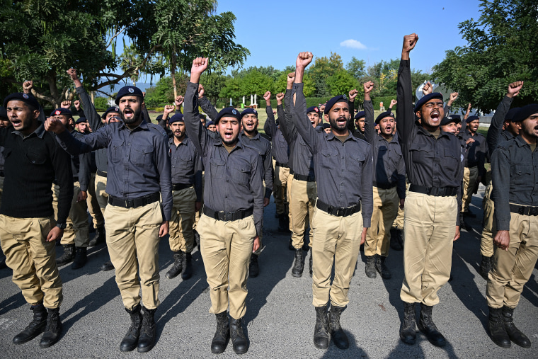 Police personnel align before being deployed near a Red Zone area blocked with shipping containers to hinder a rally by members of jailed former prime minister Imran Khan's Pakistan Tehreek-e-Insaf party demanding his release, in Islamabad on Nov. 24, 2024. 