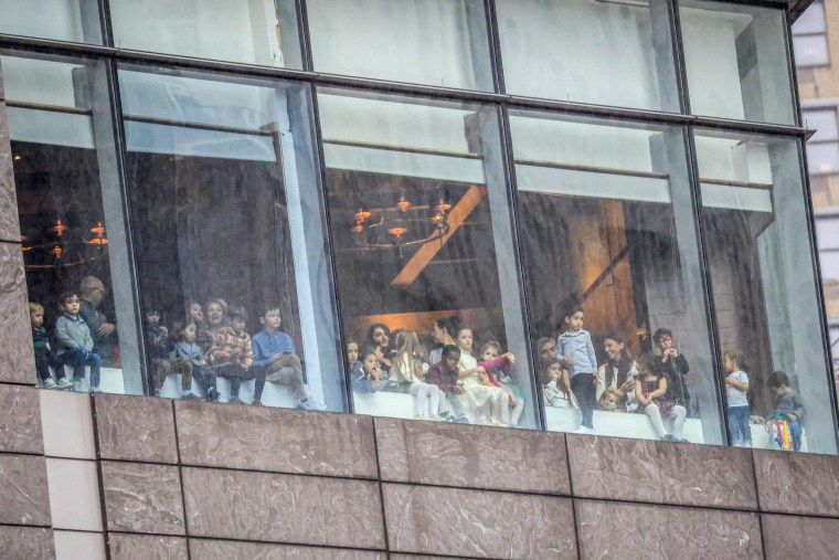 People watch the parade.