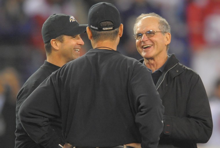 John and Jim Harbaugh with their dad Jack in 2011.