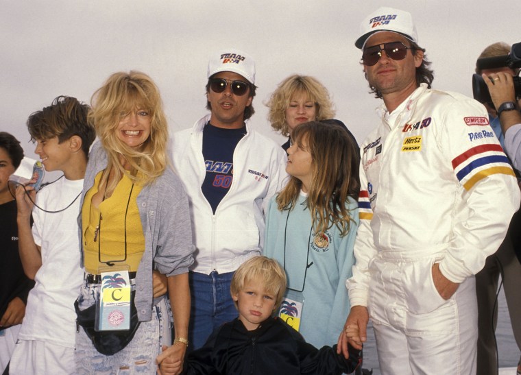 Actor Kurt Russell, actress Goldie Hawn, son Oliver Hudson, son Wyatt Russell, daughter Kate Hudson, actor Don Johnson and actress Melanie Griffith attend the 1990 Pacific Offshore Powerboat Races on April 14, 1990 at the Catalina Express Docks in Long Beach, California. 