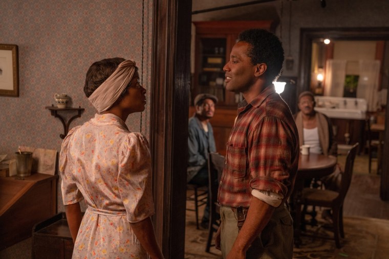 Danielle Deadwyler as Berniece, John David Washington as Boy Willie, Ray Fisher as Lymon and Samuel L. Jackson as Doaker Charles in The Piano Lesson. 