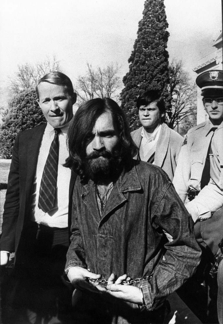 Charles Manson being led from a courthouse in Dec. 1969 in CA.