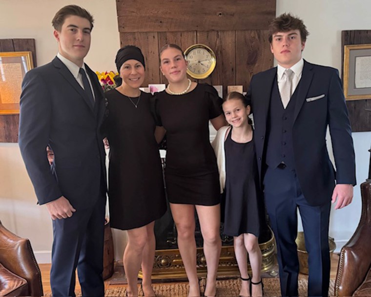 Elaine Walsh Conley on the day of her husband Scott Conley's funeral in March 2024 with children Aidan, Elaine, Kira, Shea and Max. 