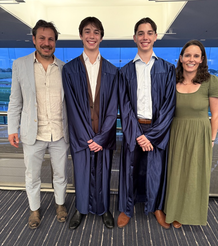 The two of us with my twin sons on their high school graduation day.