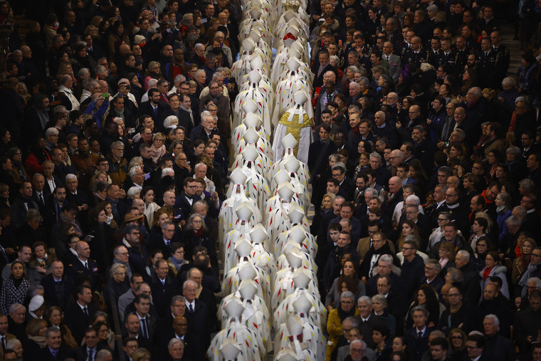 Clergy members leave at the end of the inaugural Mass.