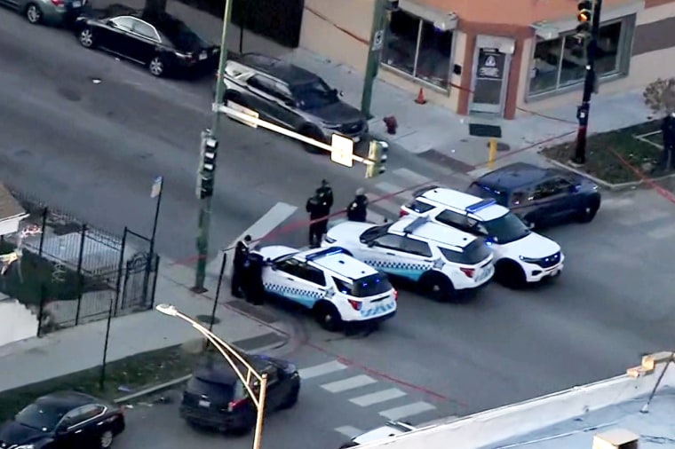 An aerial view of police investigating multiple shootings in Chicago's Gage Park neighborhood, on Monday.