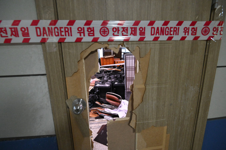 Parliamentary staffers used sofas and fire extinguishers to block soldiers armed with assault rifles and night-vision goggles from entering South Korea's National Assembly to maintain martial law, CCTV footage released on December 4 showed.