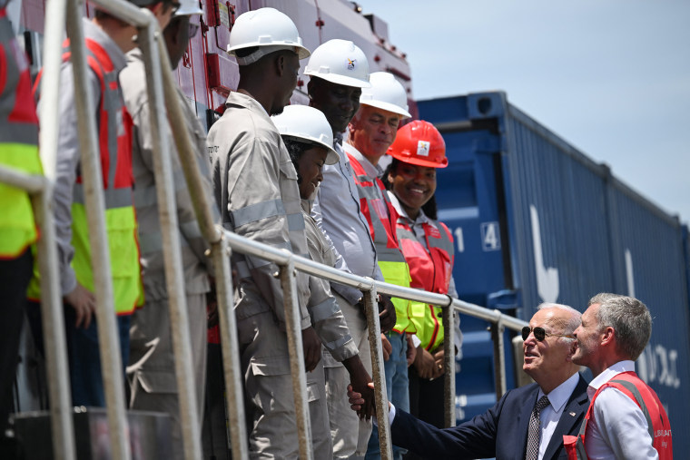  Joe Biden shakes hands with workers 