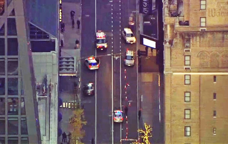 Police near the scene of a shooting in Midtown Manhattan on Dec. 4, 2024.