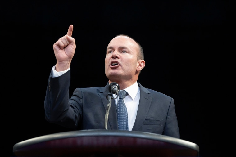 Mike Lee points as he speaks