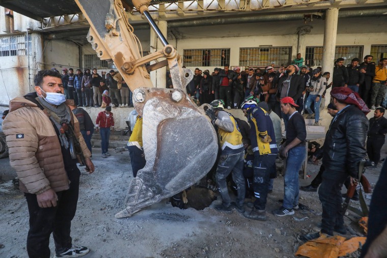 Syrian White Helmets civil defence members and experts search for potential hidden basements at the Saydnaya prison in Damascus on Dec. 9, 2024. 