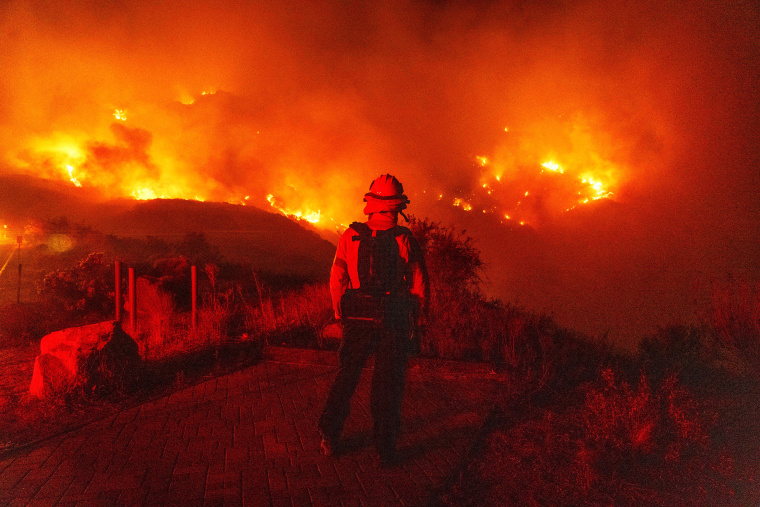 Malibu fire rages on as famous locals evacuate