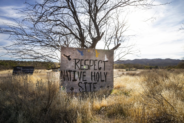 A woody motion that says "Respect Native Holy Site" successful a tract of writer outside