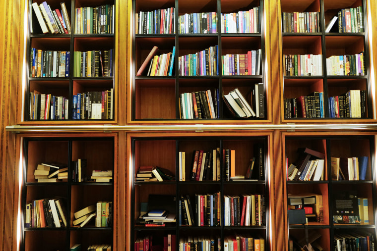 A bookcase filled with modern and historical titles from around the world. 