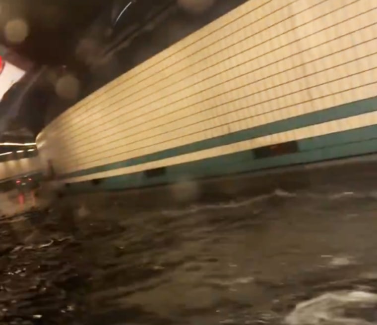 Flooding caused by heavy rain in the I-93 tunnel in Boston.