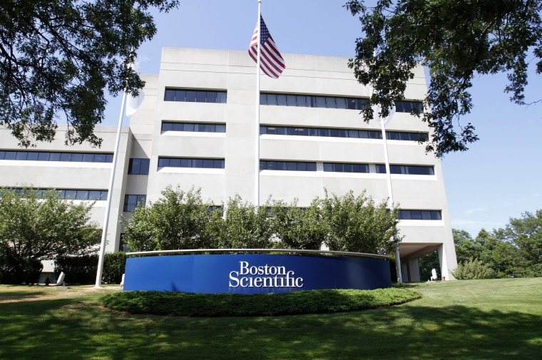 A building with an American flag and "Boston Scientific" sign.