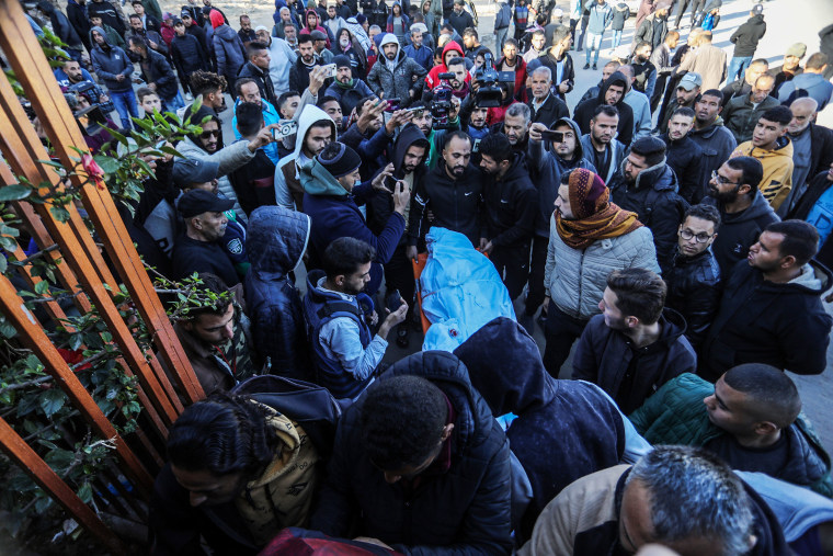Bodies of Palestinians who lost their lives in the Israeli strike on a school-turned shelter are taken from the morgue of Nasser hospital for burial in Khan Yunis, Gaza on Dec. 16, 2024.