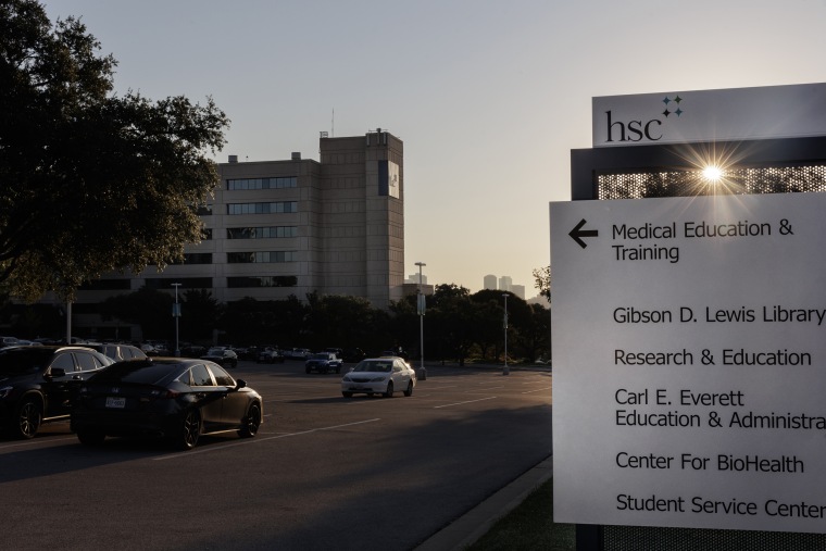 A sign with directions for the Health Science Center.