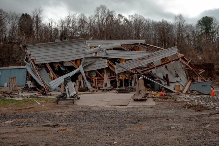 A stone slab company's building was smashed by another warehouse occupied by the Asheville Tea Company.