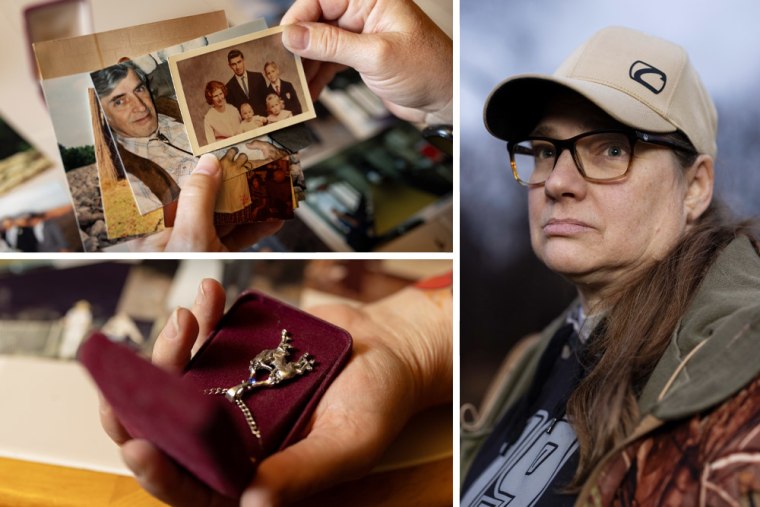 Fran Moore holds family photographs of her father, Carl Yenner, and a unicorn necklace he gave her.