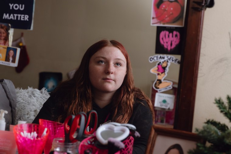 Melissa Krajewski sits by the mirror