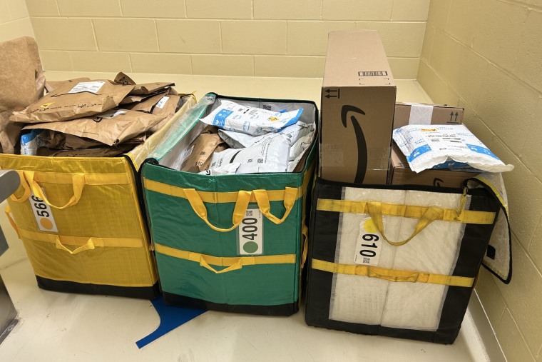 Lakeville police discovered three bags of Amazon packages unattended on the side of the road in a wooded area off Bedford Street early Sunday morning.