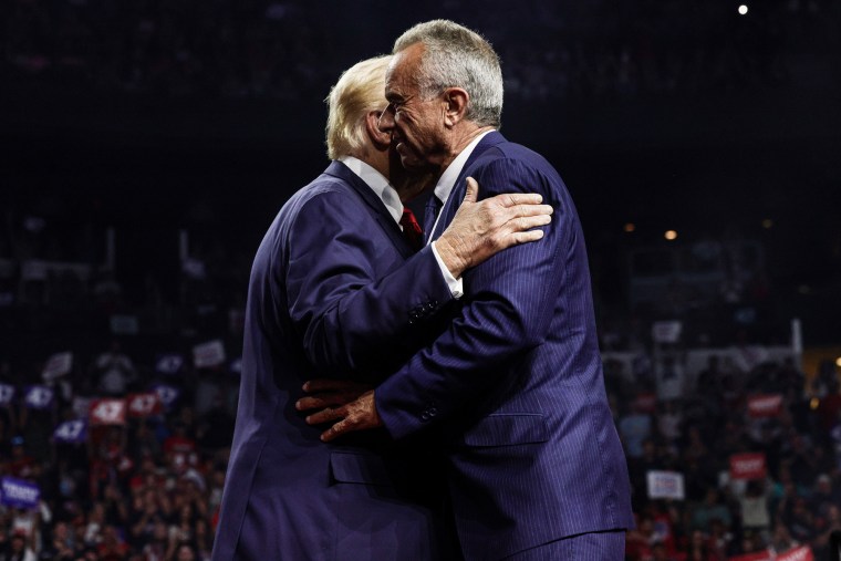 Donald Trump, left, and Robert F. Kennedy, Jr. hug