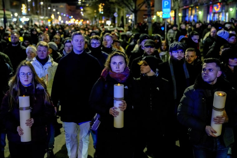 People attend an AfD march in front of the cathedral in Magdeburg on Monday.