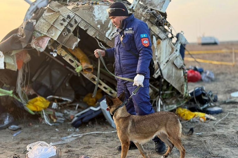 Rescuers work at the wreckage of an Azerbaijan Airlines flight near Aktau on Thursday.