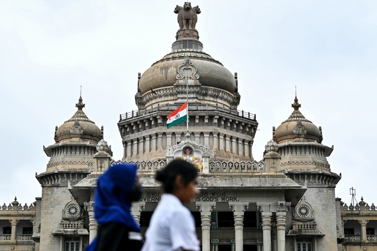 The Indian national flag flies half-mast at the Vidhana Soudha to mourn the death of former Indian Prime Minister Manmohan Singh, in Bengaluru on December 27, 2024.