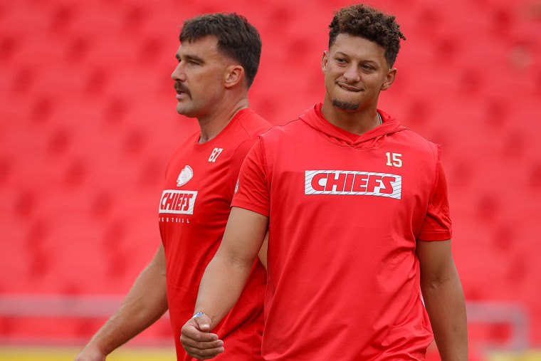 Kansas City Chiefs teammates Travis Kelce, left, and Patrick Mahomes during pregame warmups on Aug. 22, 2024.