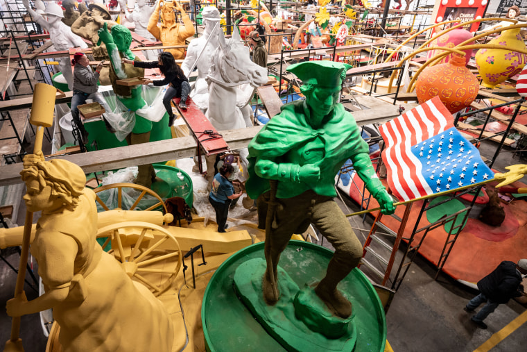 Volunteers prepare floats for the 136th annual Rose Parade