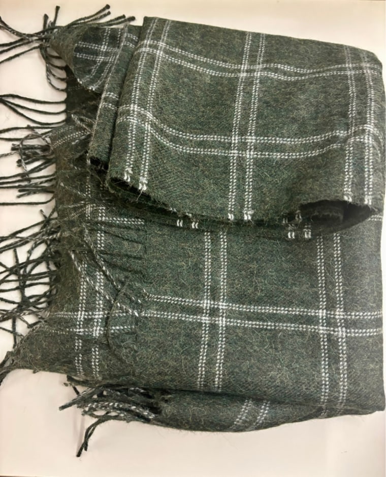 Alpaca Brooklinen Windowpane Throw Blanket folded on table.