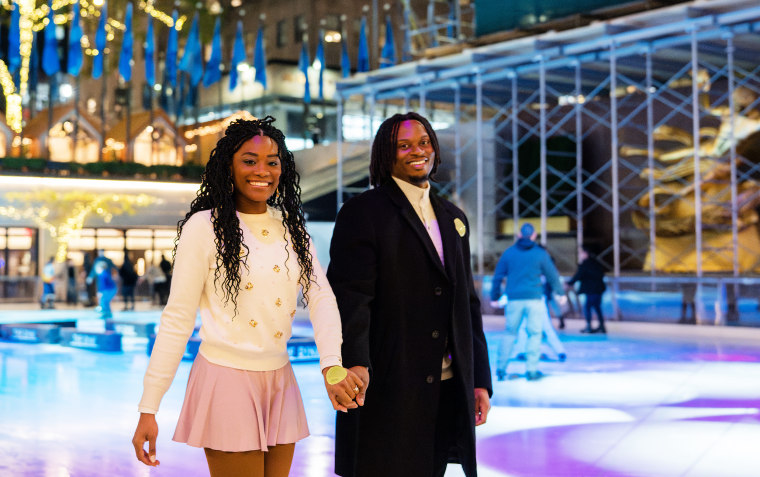 Ivana Hughes and Douglas Brown skating off Rockefeller Rink after getting engaged. 