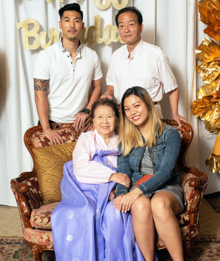 Philip Cho, his grandfather, his grandmother and his fiancé Heather Nguyen take a portrait together. During their engagement, Cho used words of wisdom from his grandmother.