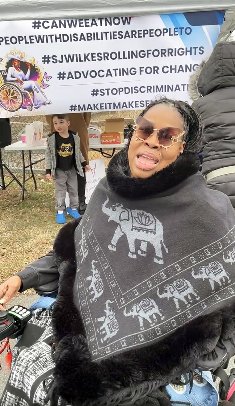 A protester outside of a Cracker Barrel in Waldorf, Maryland on Dec. 15.